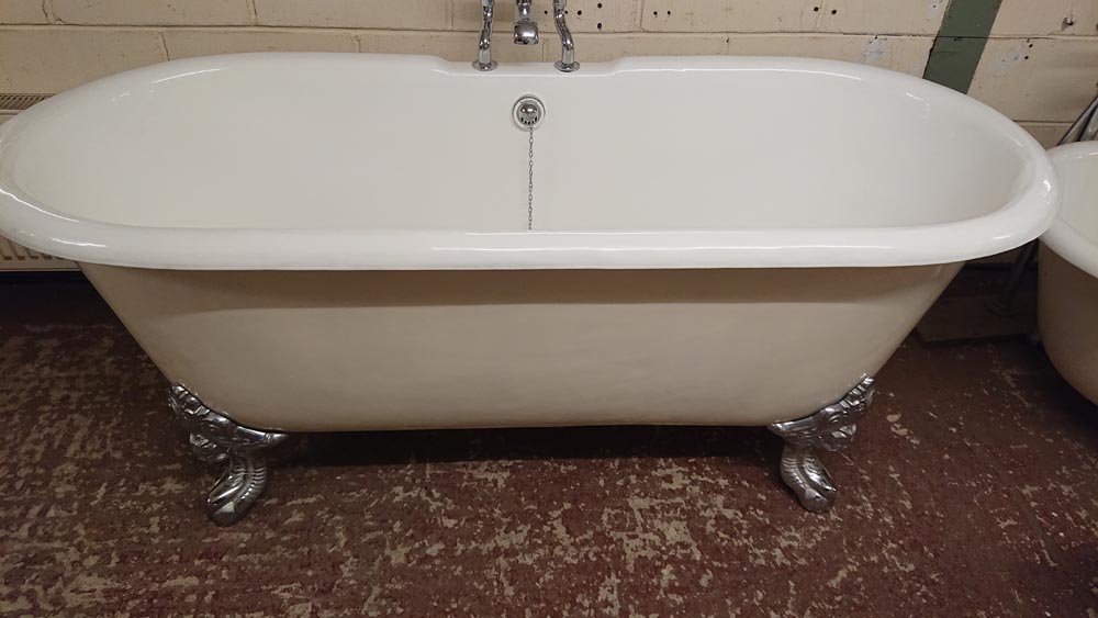 <p>Large Cast iron roll top enamelled bath complete with:</p><p>Burlington Taps, stand pipe and waste.</p><p>Bath: 183 cm wide x 75 cm high x 78 cm deep