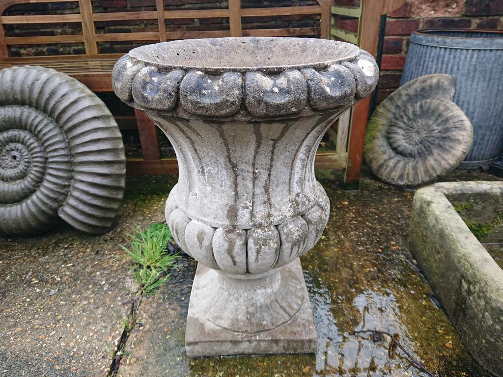 <p>Weathered cast Urn