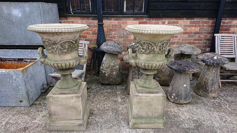 <p>Pair Georgian style Urns on Plinths</p>