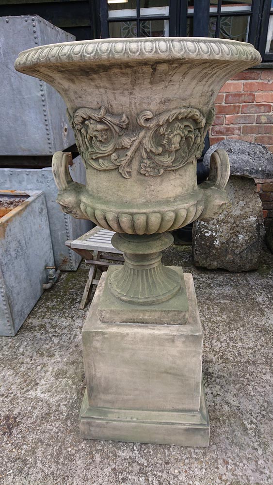 <p>Pair Georgian style Urns on Plinths</p>