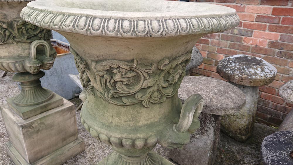 <p>Pair Georgian style Urns on Plinths</p>