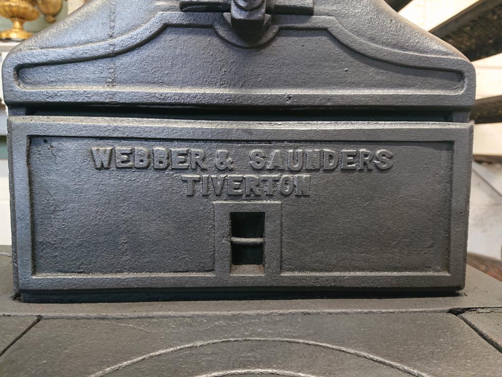 <p>Original cast iron range cooker from Webber and Saunders Tiverton.</p><p>76 cm wide x 92 cm high. Ornamental use only.</p>