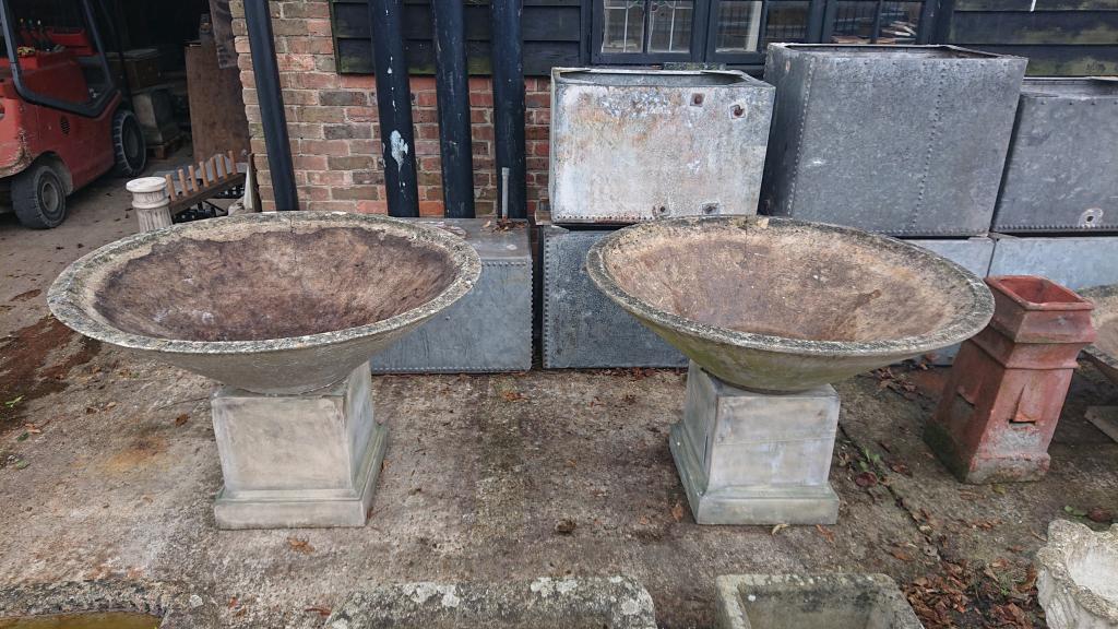 <p>Three large mid centry concrete planters</p><p>4 ft diameter 16" tall without base