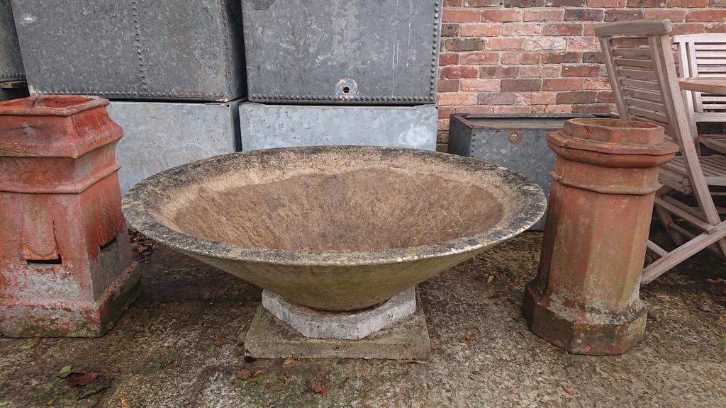 <p>Three large mid centry concrete planters</p><p>4 ft diameter 16" tall without base