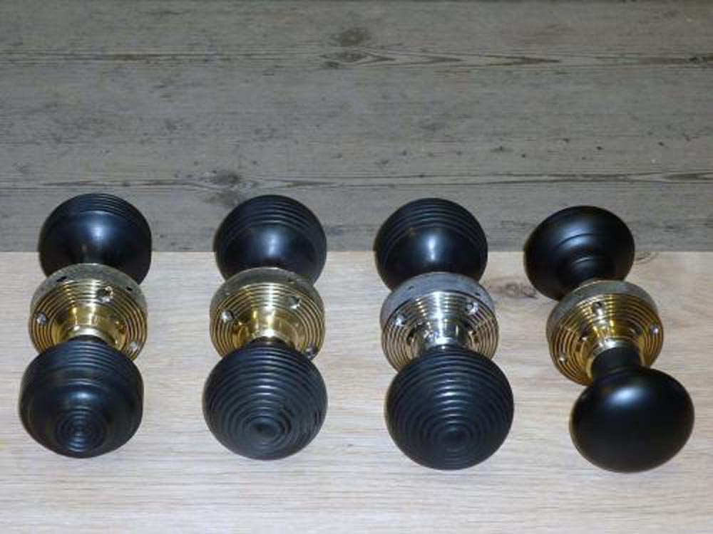 Selection of Ebonised wooden door handle with brass or nickel back plates .