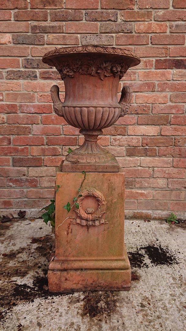 <p>Nicely weathered Terracotta coloured Urn